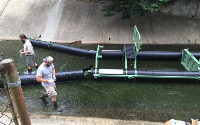 Anacostia Riverkeeper installs a Bandalong Litter Trap located in the Arundel Canal in Mount Rainier.